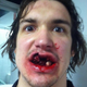 Illustration for article titled Red Wings Prospect Takes Puck To Mouth, Tweets Photo Of Aftermath